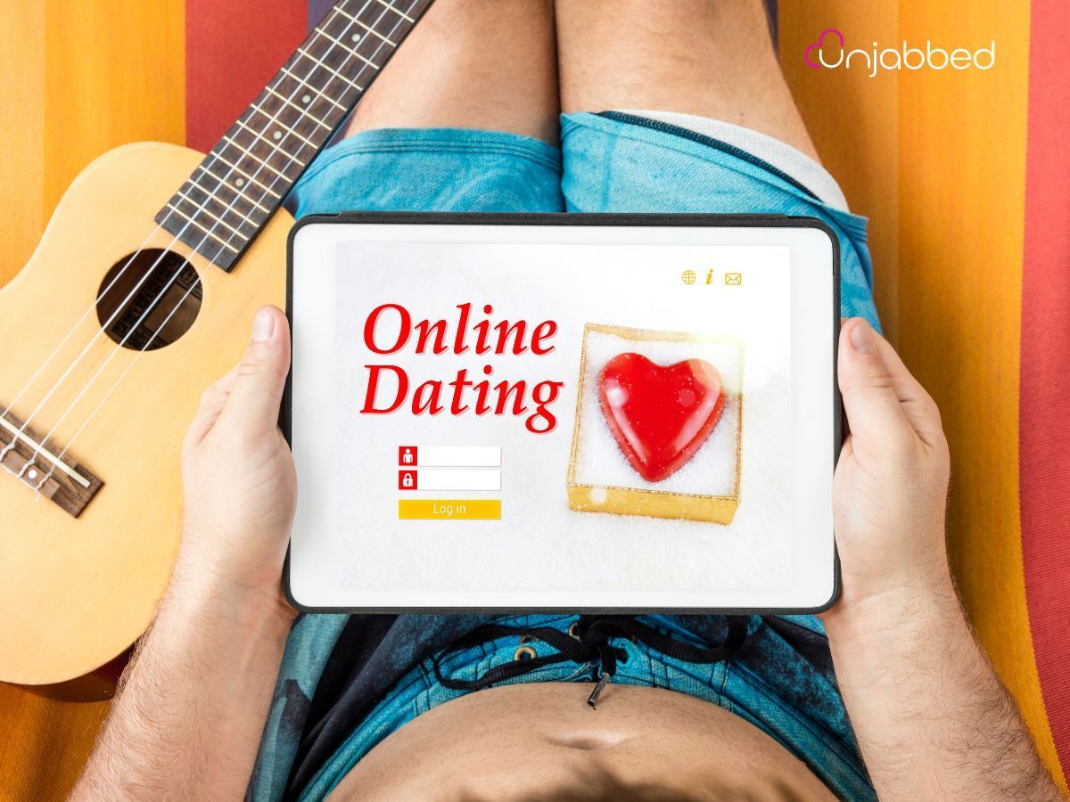 Looking at a tablet with the words Oline dating. This is regarding the rise of Unvaccinated dating websites.